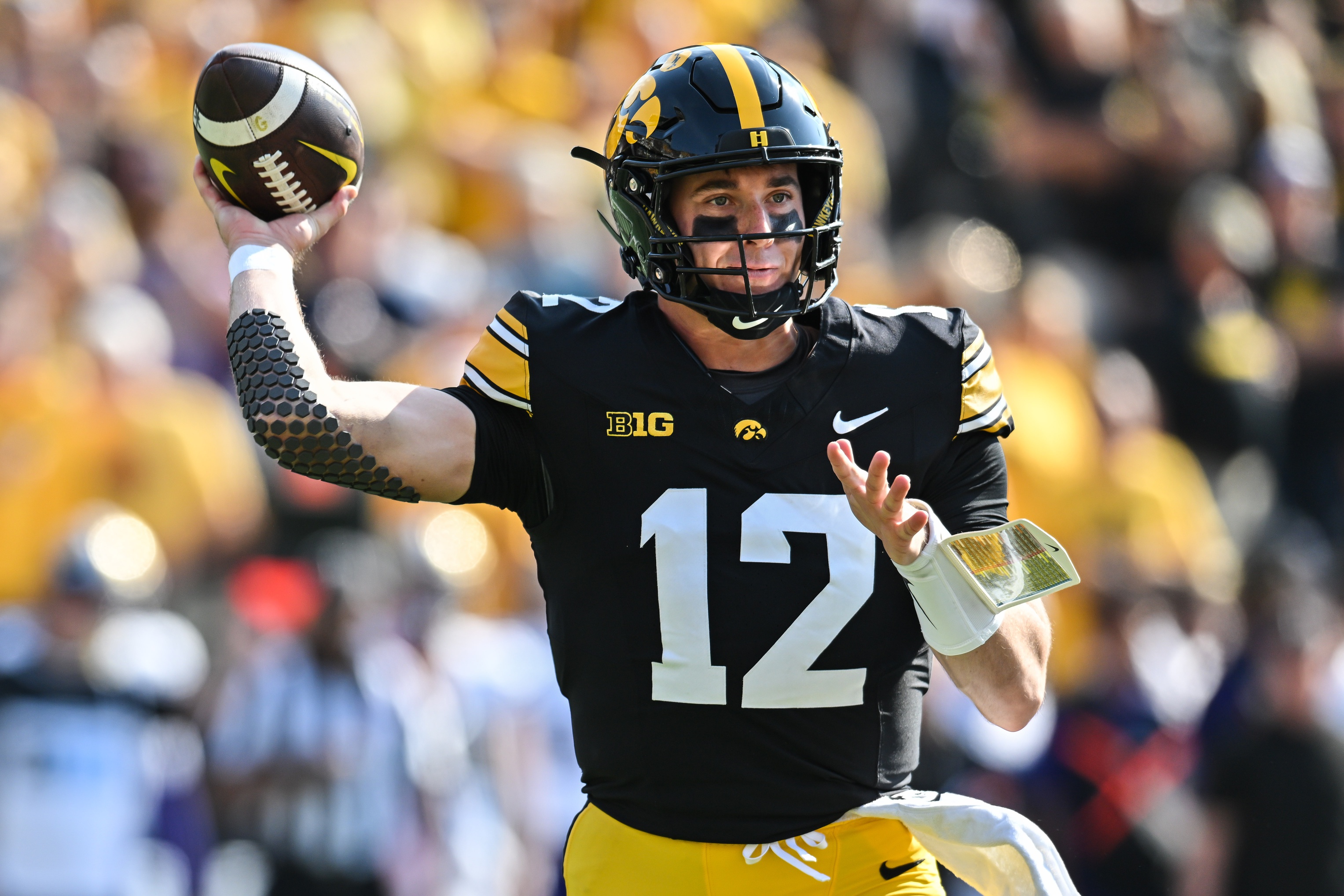 college football picks Cade McNamara Iowa Hawkeyes predictions best bet odds